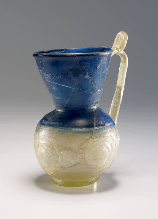 Blue and decolourized jug with circle ornaments