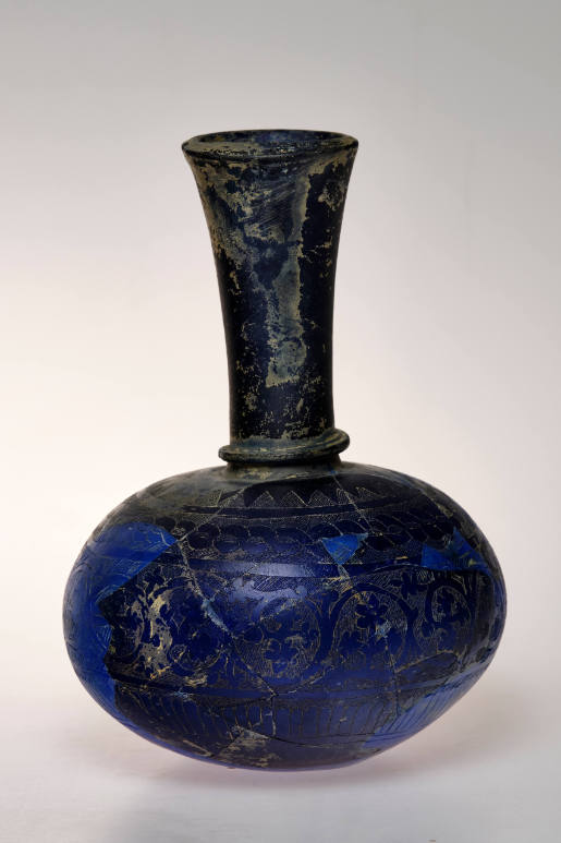 Blue bottle with foliate scrollwork