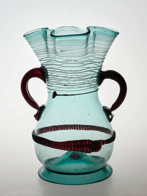 Drinking vessel with violet-coloured handles