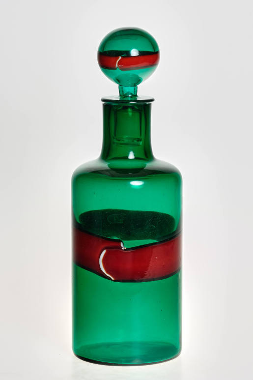 Green decanter with red ribbon and stopper