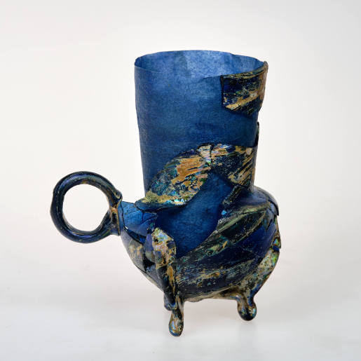 Cup with handle and three feet